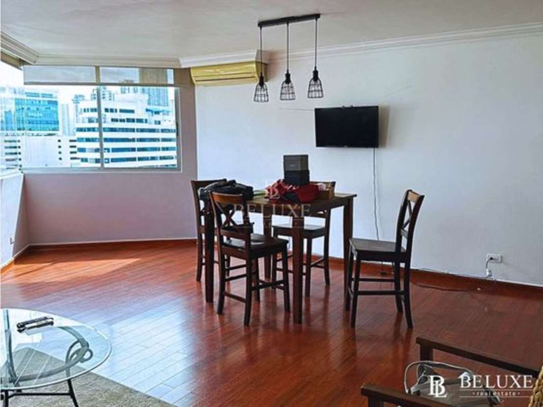 Open living and dining space with large windows city skyline PH Las Marquesas San Francisco Panama City