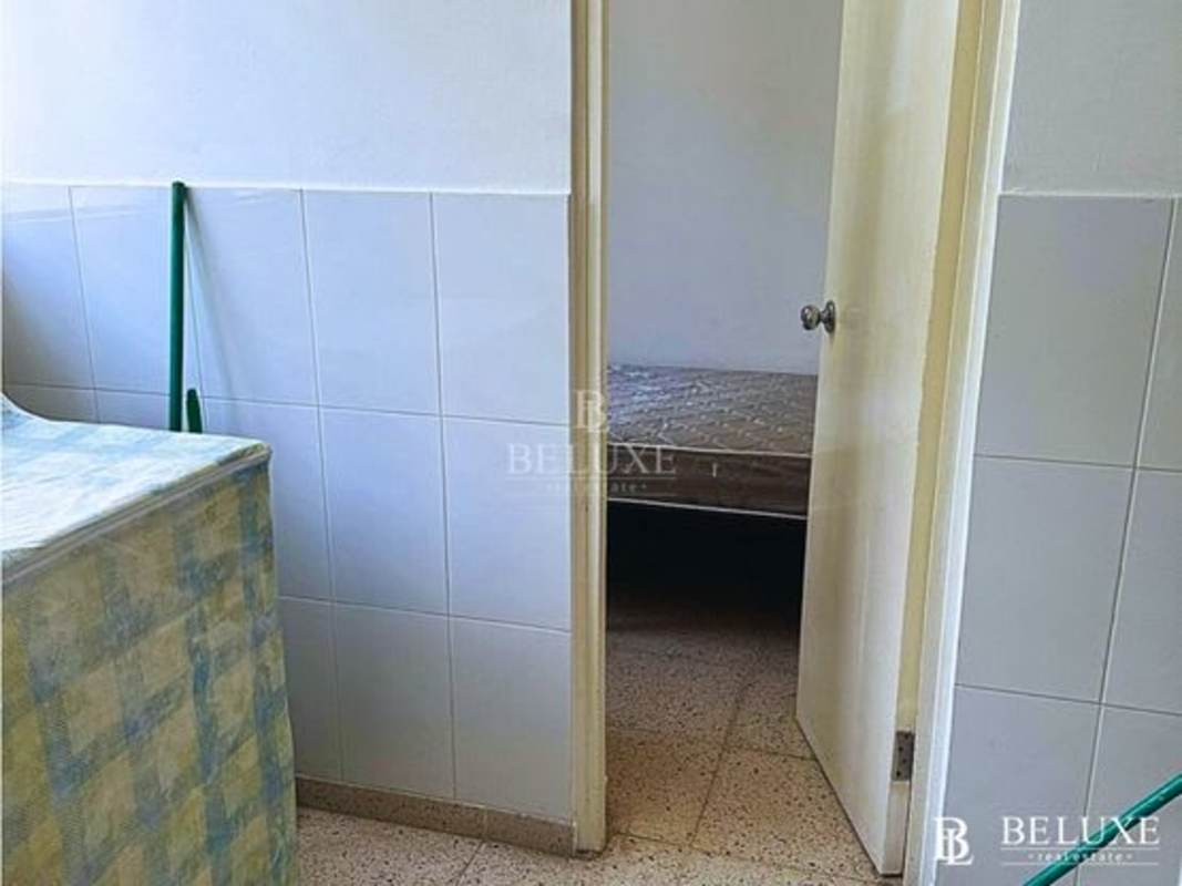 Bright bedroom with city view windows ceramic tile floors PH Las Marquesas Panama