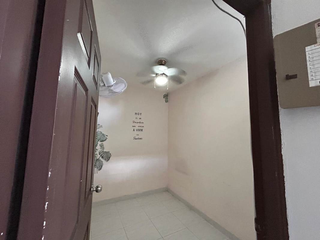 Bright spacious living room with large panoramic windows and city view at PH Brisas de Obarrio Panama