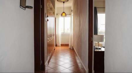 Hallway with built-in wood closets bright space Vista Mar beachfront condo Panama