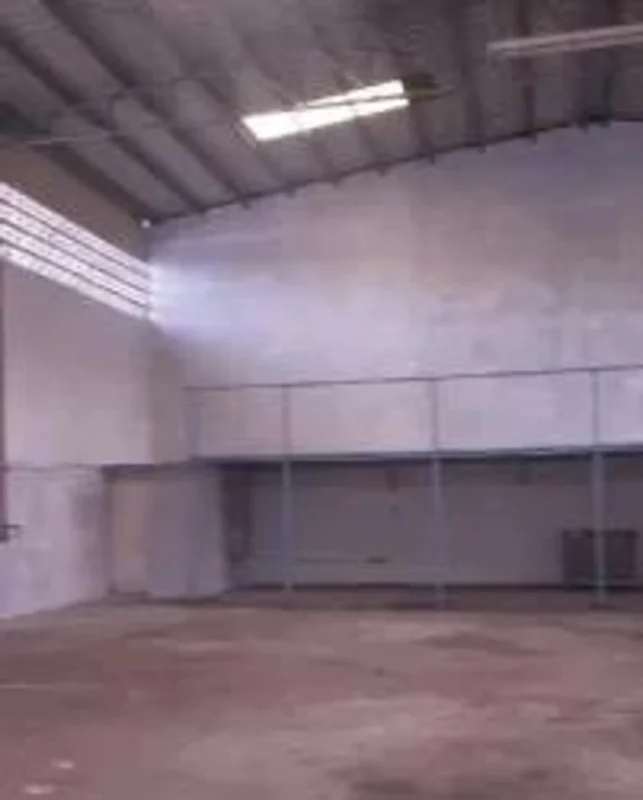 Empty warehouse with metal roof and concrete floor at Monte Oscuro Panama City