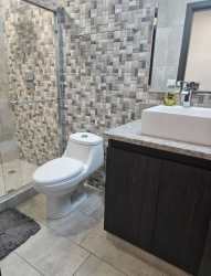 Kitchen with granite countertops modern cabinetry in PH Forest Towers Panama