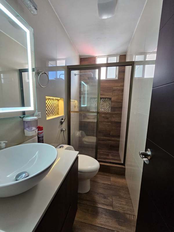 Equipped kitchen with cabinetry, stove and tiles in El Cangrejo PH Atlantis Panama