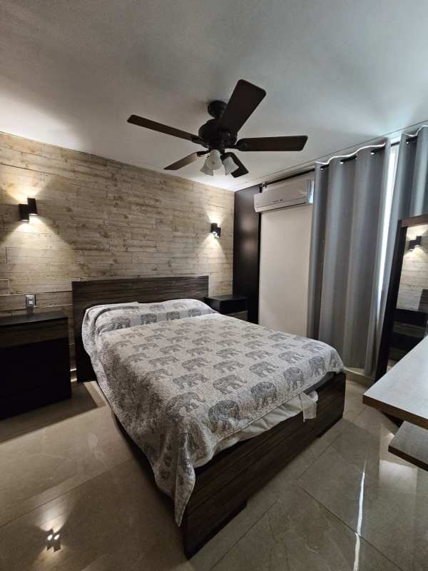 Master bedroom with large windows, walk-in closet, air conditioning at PH Atlantis El Cangrejo Panama City