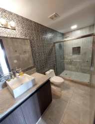 Stylish bathroom with glass enclosed shower PH Tucan Panama