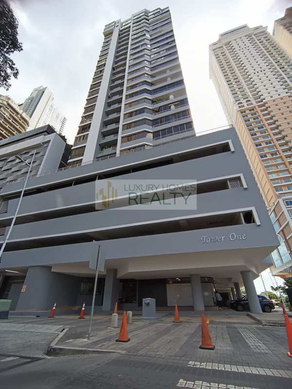 Kitchen with granite countertops and wooden cabinetry in PH Tower One Panama City