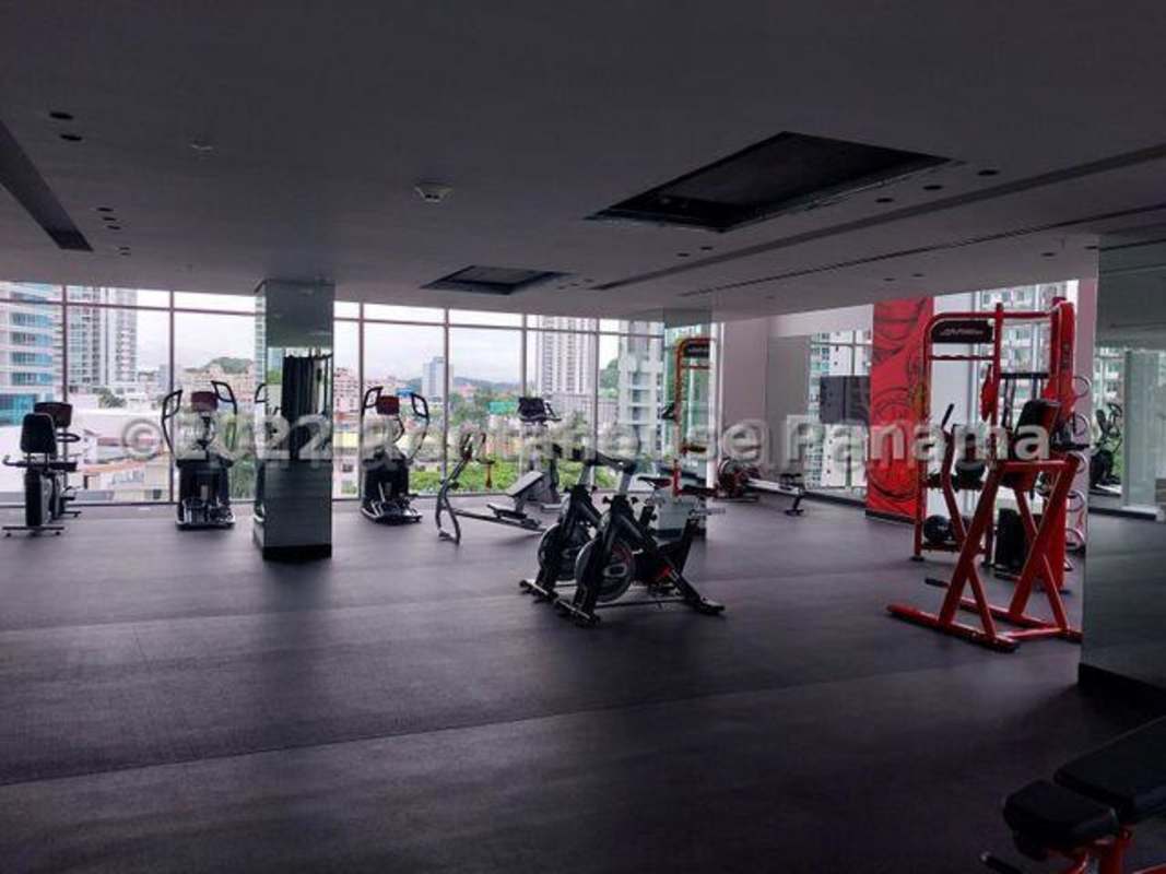 Modern gym with panoramic windows and equipment in Park City Tower Bella Vista Panama