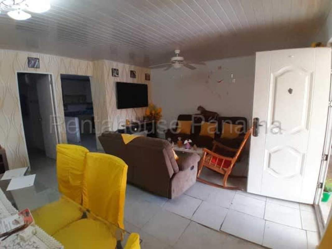Simple kitchen with granite countertop, wood cabinets, ceramic tile in Parque Real home Tocumen