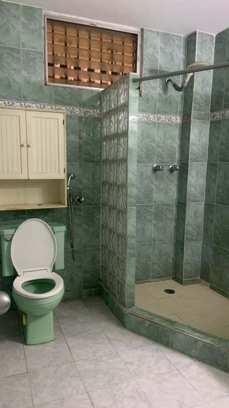 Bathroom with green tiles and glass block shower Edificio Monserrat Obarrio Panama
