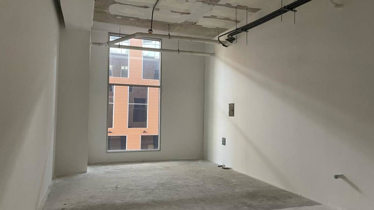 Empty shell office space with large window exposed concrete Costa del Este Panama