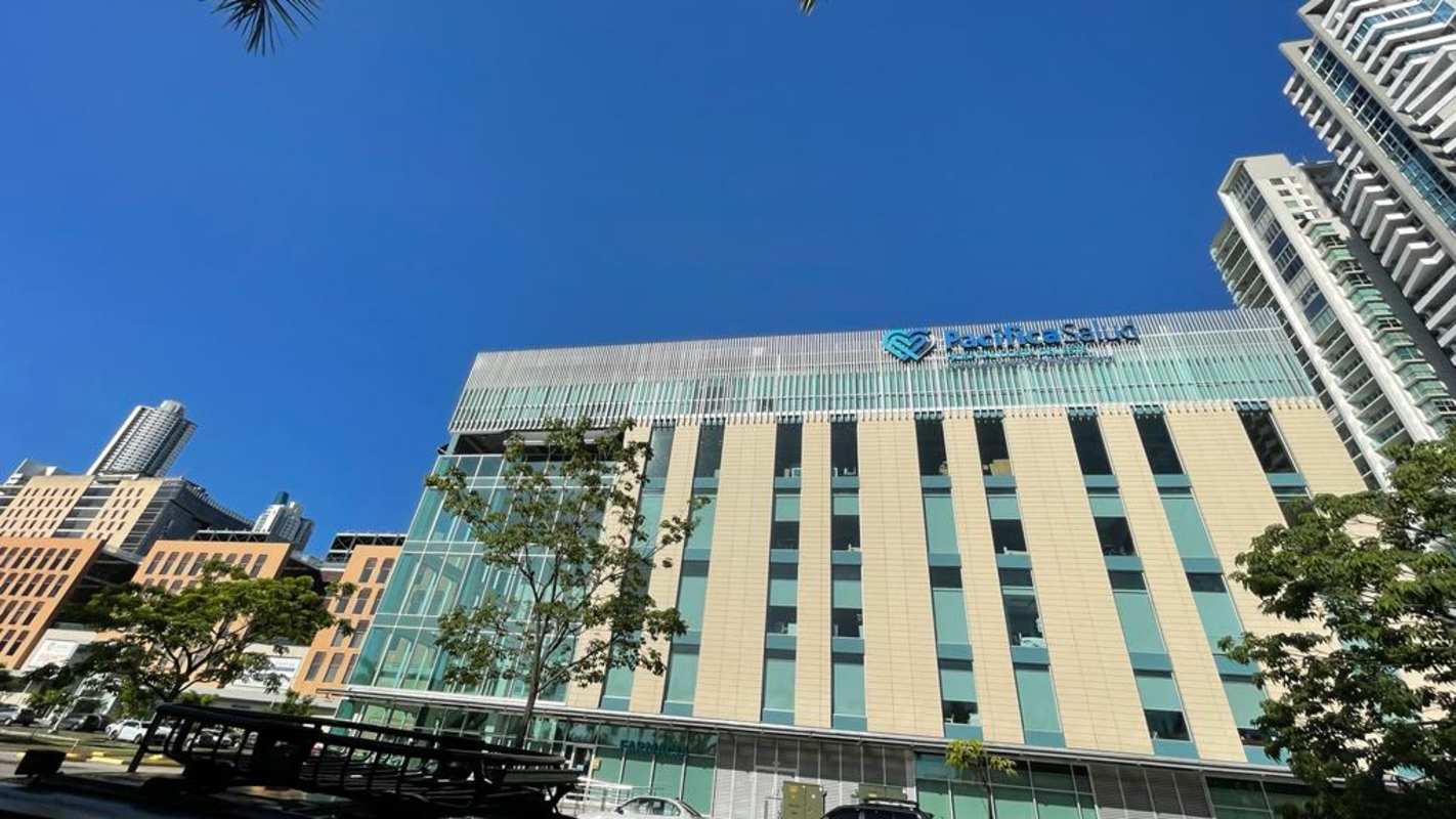 Modern multi-story commercial buildings with glass facades and signage Town Center Costa del Este Panama