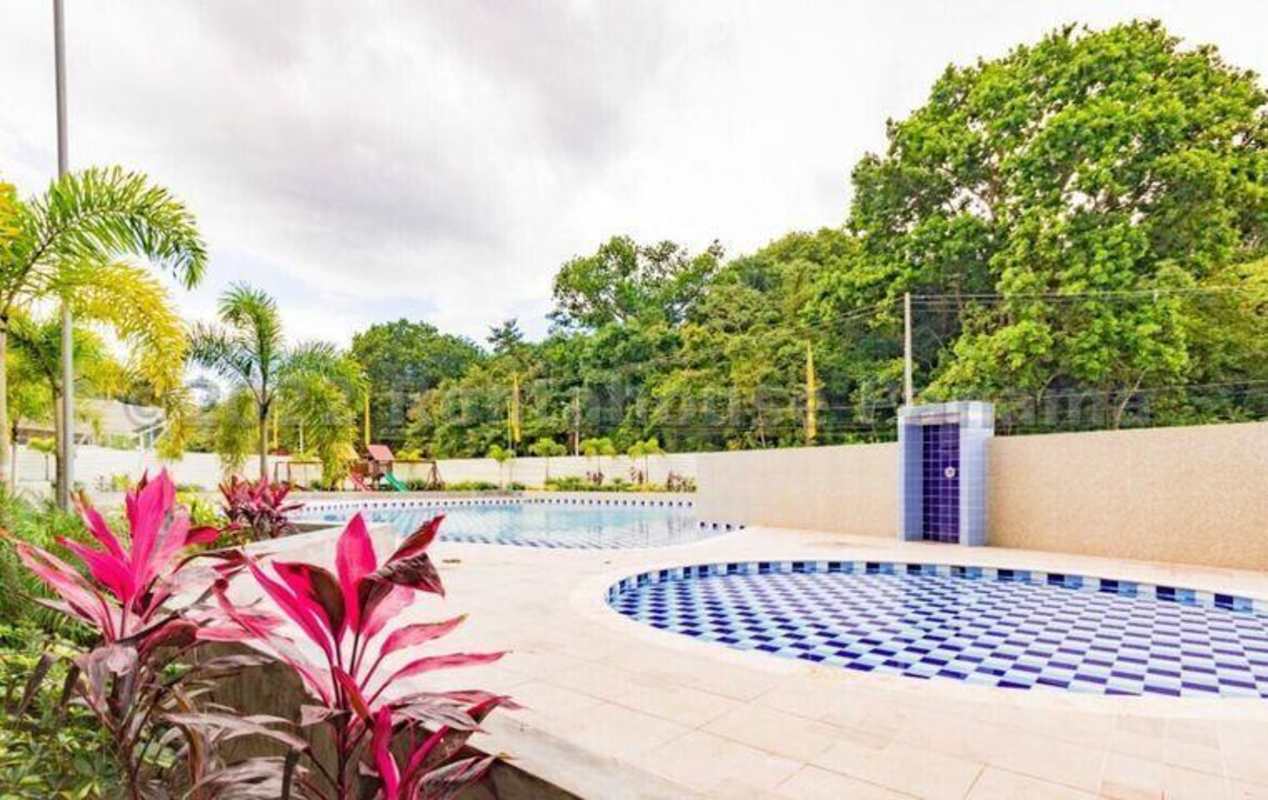 Kitchen with granite countertops, wood cabinetry, and tile backsplash in PH Hacienda del Golf II Panama