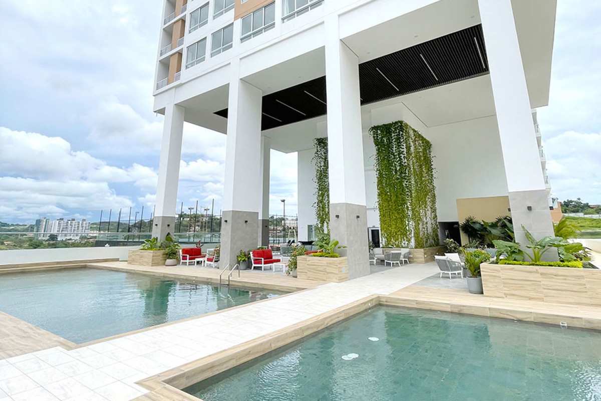 Outdoor pool with green wall, modern amenities, seating areas Greenwood Towers Panama City