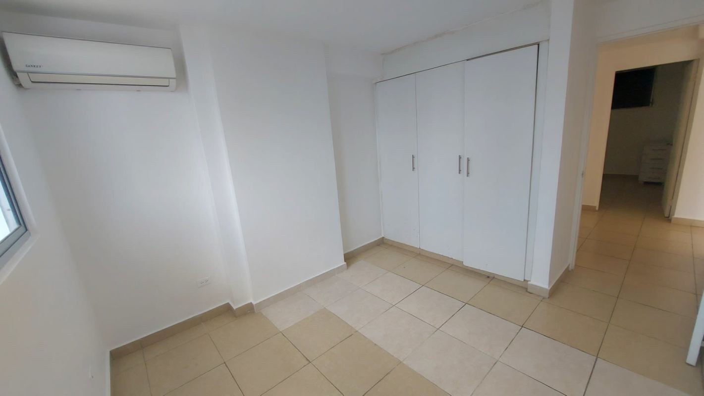 Bright bedroom with tile floors and window in PH Bella Vista Gardens near La Cresta Panama City