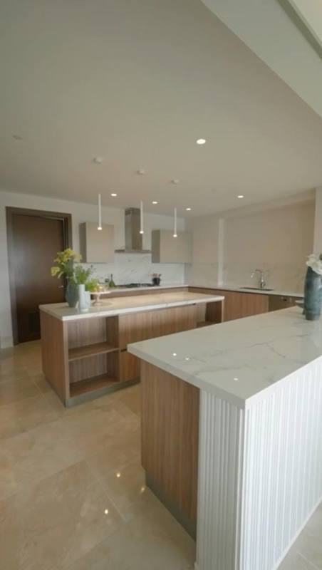 Infinity pool luxury condominium with sun deck tropical landscaping at Santa María