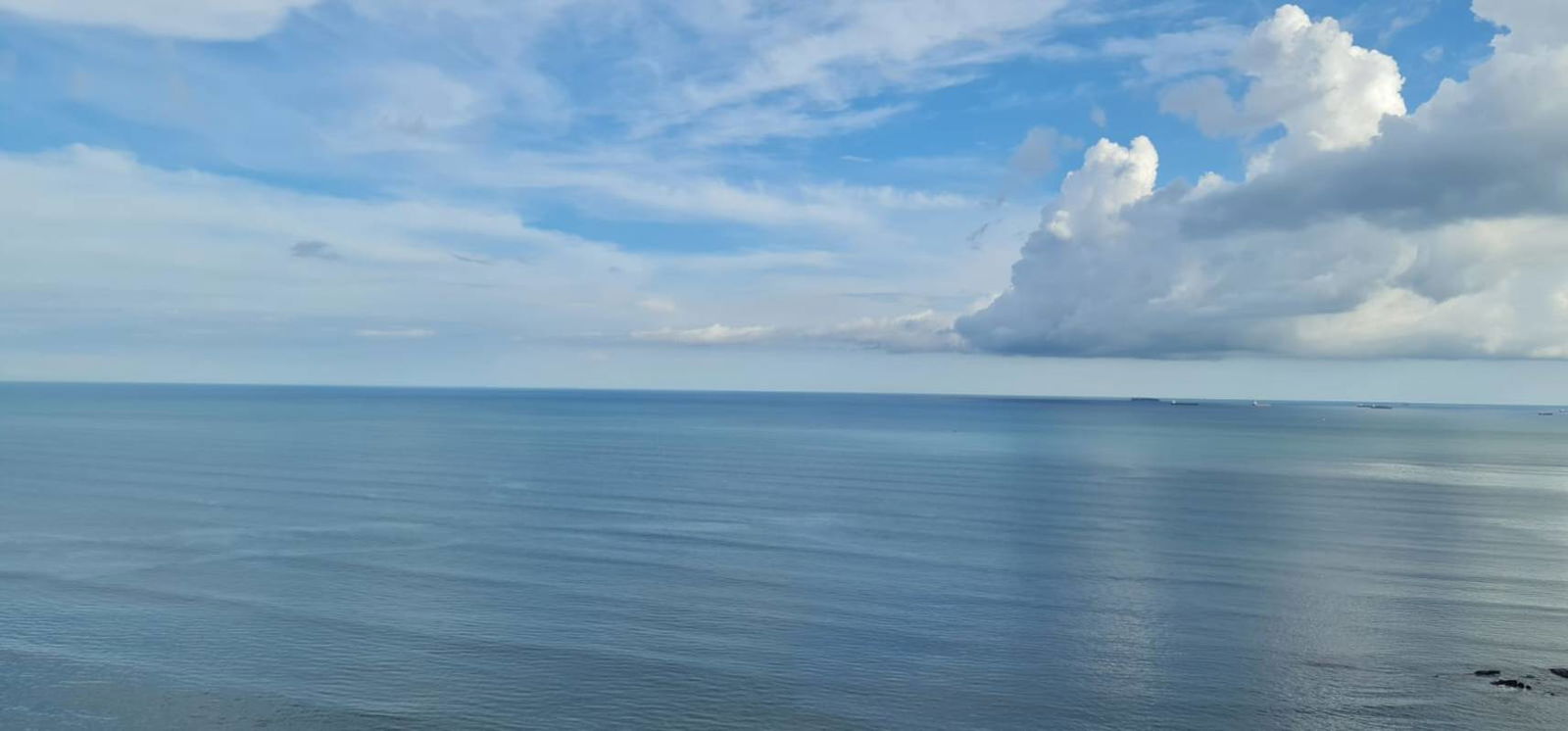 Pacific Ocean sunset with colorful sky viewed from PH Terrasol apartment balcony
