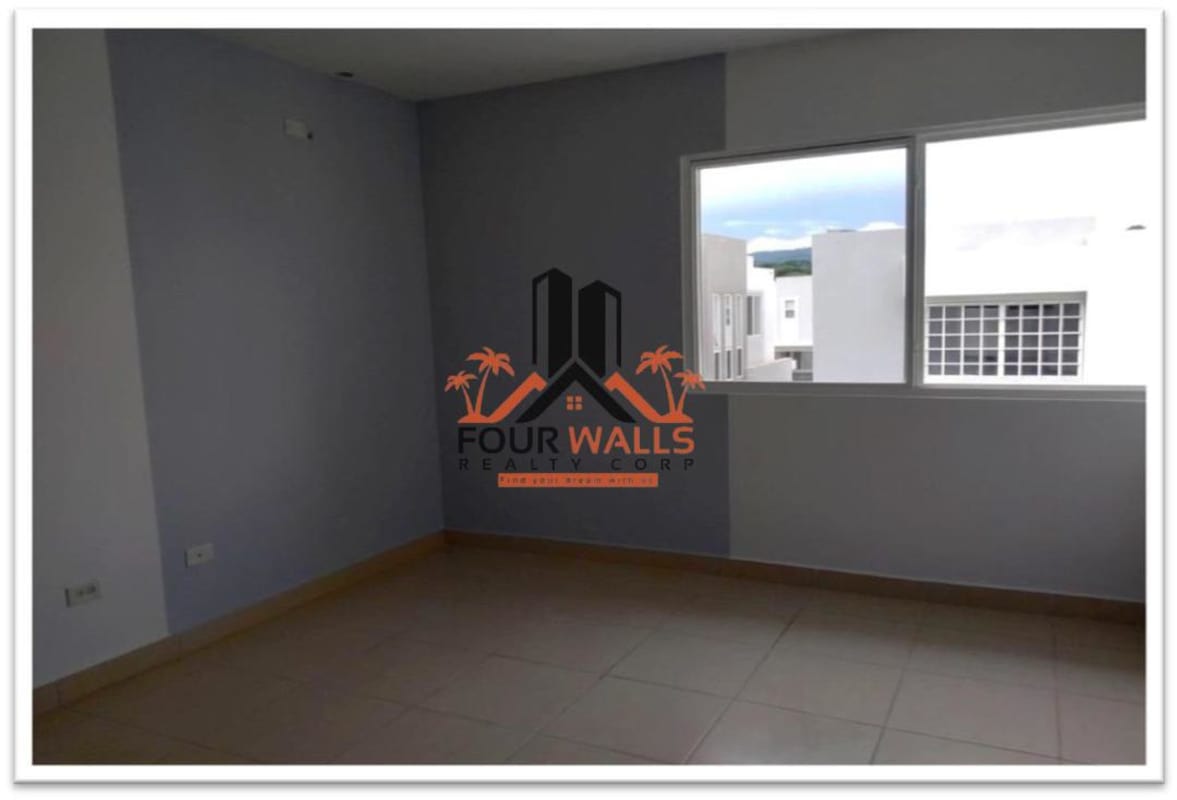 Bright bedroom with ceramic tile floors and large window in PH Augusta Brisas del Golf Panama