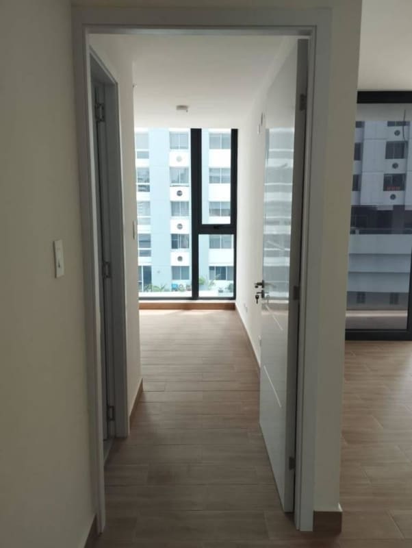 Living room with large window and balcony access PH Le Mans Panama