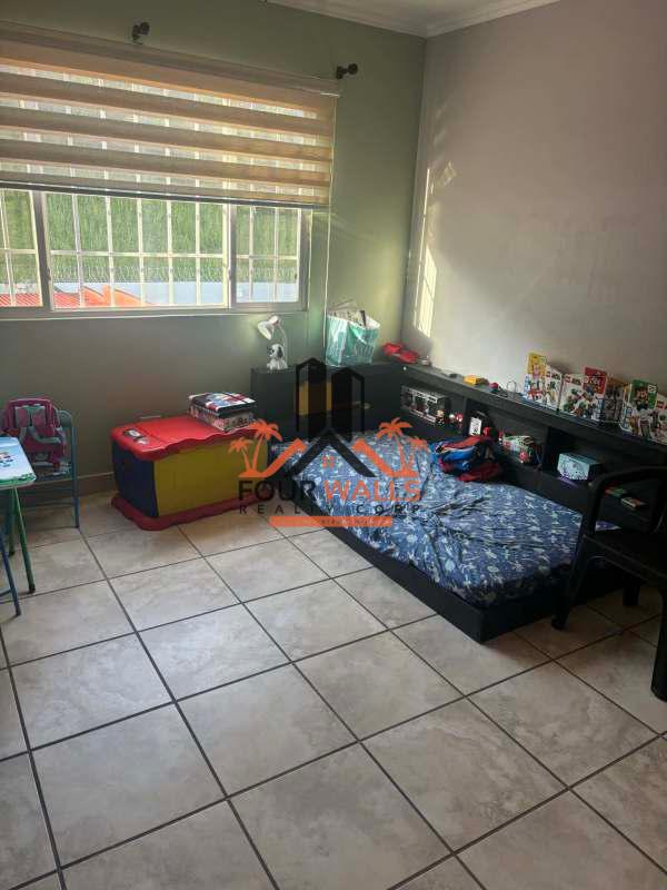 Bathroom with stylish tile and sink in house for sale Brisas del Golf Panama