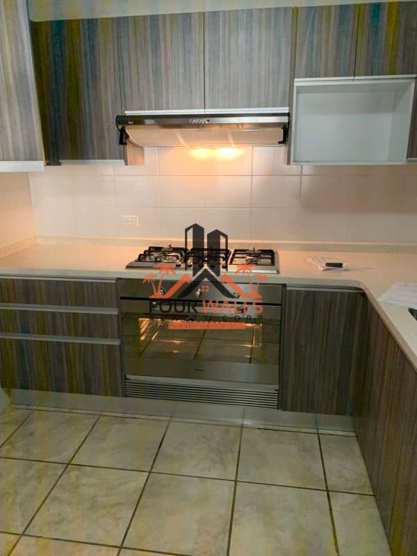 Children's room with tiled floor and large window in family house Panama
