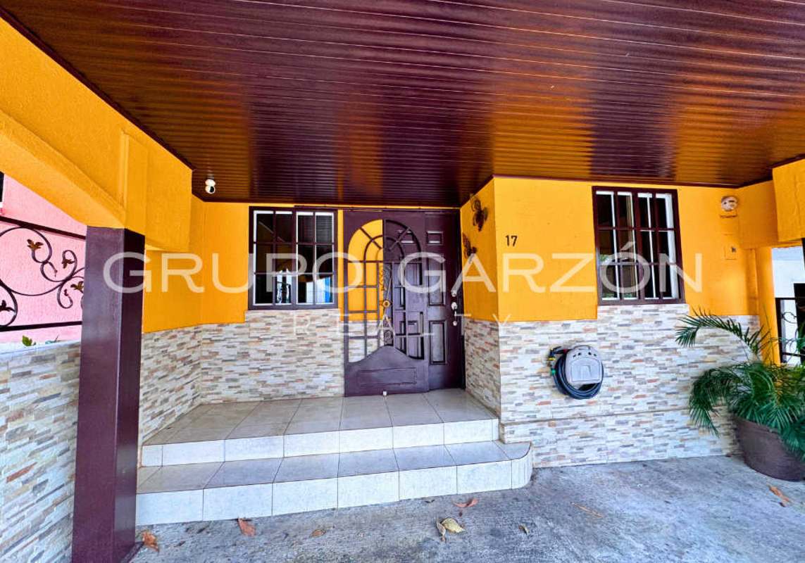 Kitchen with ceramic tiles, granite-style counters and appliances in Villas El Naranjal Pedregal Panama