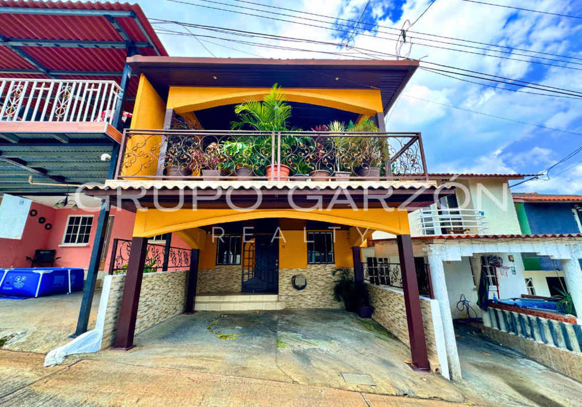 Spacious covered terrace balcony with Mediterranean arches, ceiling fan and bar area in Villas El Naranjal Pedregal
