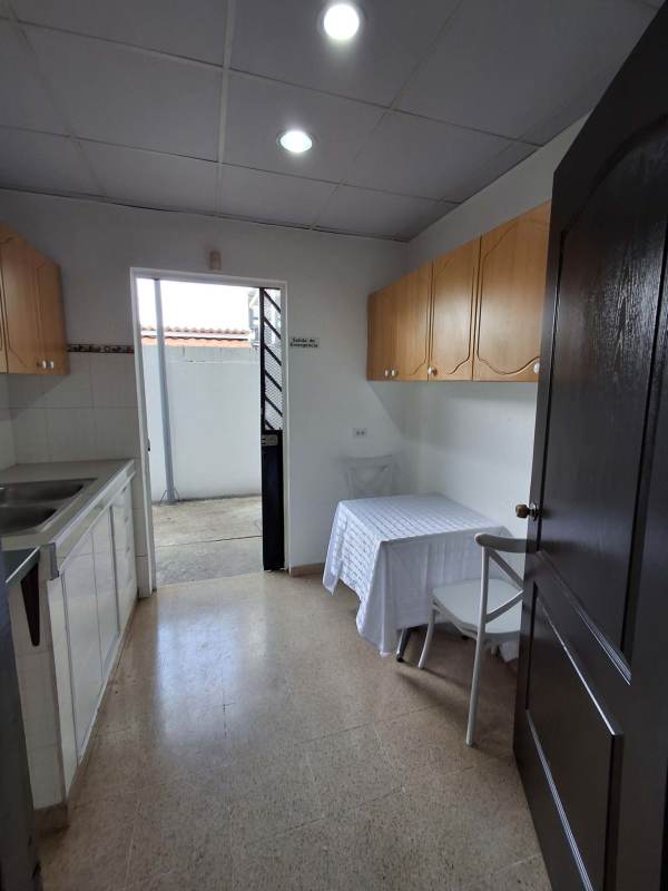 Traditional kitchen with wooden cabinets and double sink in Campo Limberg