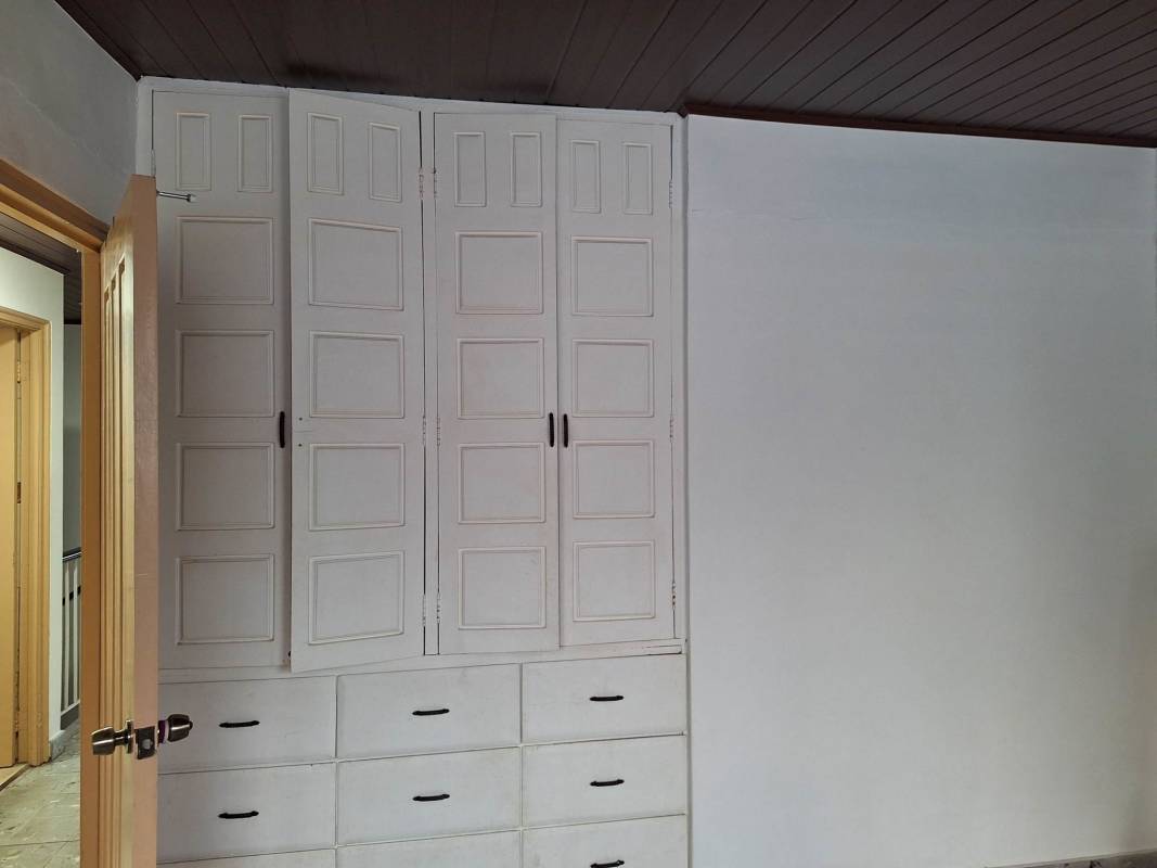 Empty room with ceiling fan natural light tiled floor at affordable room rental Bethania Panama City