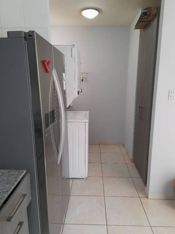 Laundry area with washer dryer fridge Edificios Mallorca Panama City