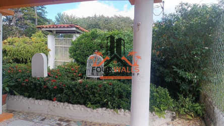 Traditional kitchen with ceramic countertops and open shelving in beach house San Carlos Panama