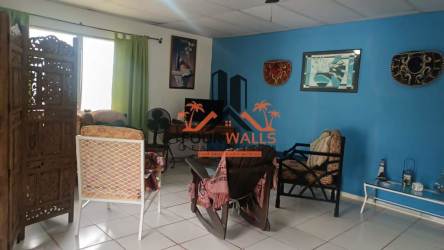 Dining room with open kitchen design in beach house San Carlos Panama Hola Realty