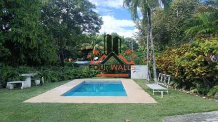 Covered patio terrace with tropical landscaping at beach house for sale San Carlos Panama