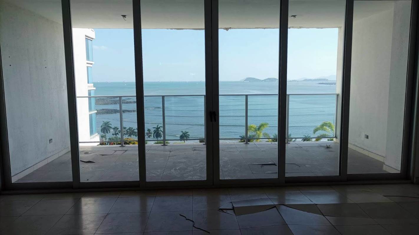 Kitchen with granite counters, wooden cabinetry and double sink PH Waters on the Bay Avenida Balboa Panama