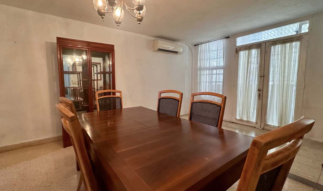 Dining room with wood table, chandelier, air conditioning Las Fuentes Panama