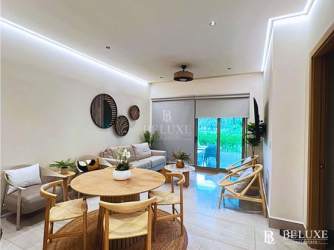 Modern open living and dining space with tropical views at Playa Escondida villa Colon Panama