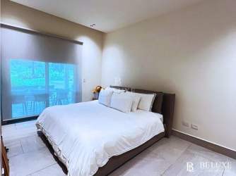 Modern bedroom with sliding glass doors, natural light near Caribbean beach Playa Escondida Colon Panama