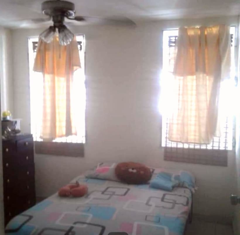 Basic bedroom with ceiling fan, tiled floor and secure window Carrasquilla Via España Panama