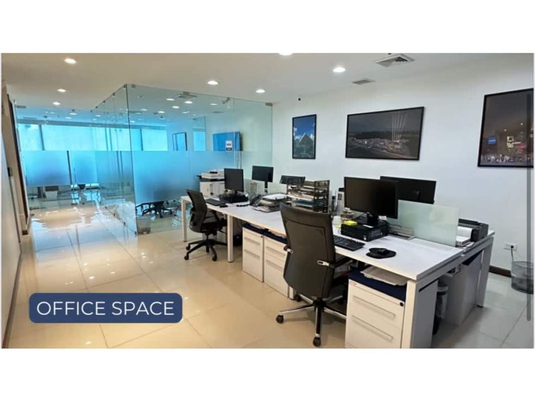 Elegant reception lobby with glass reception desk and designer lighting Oceania Business Plaza