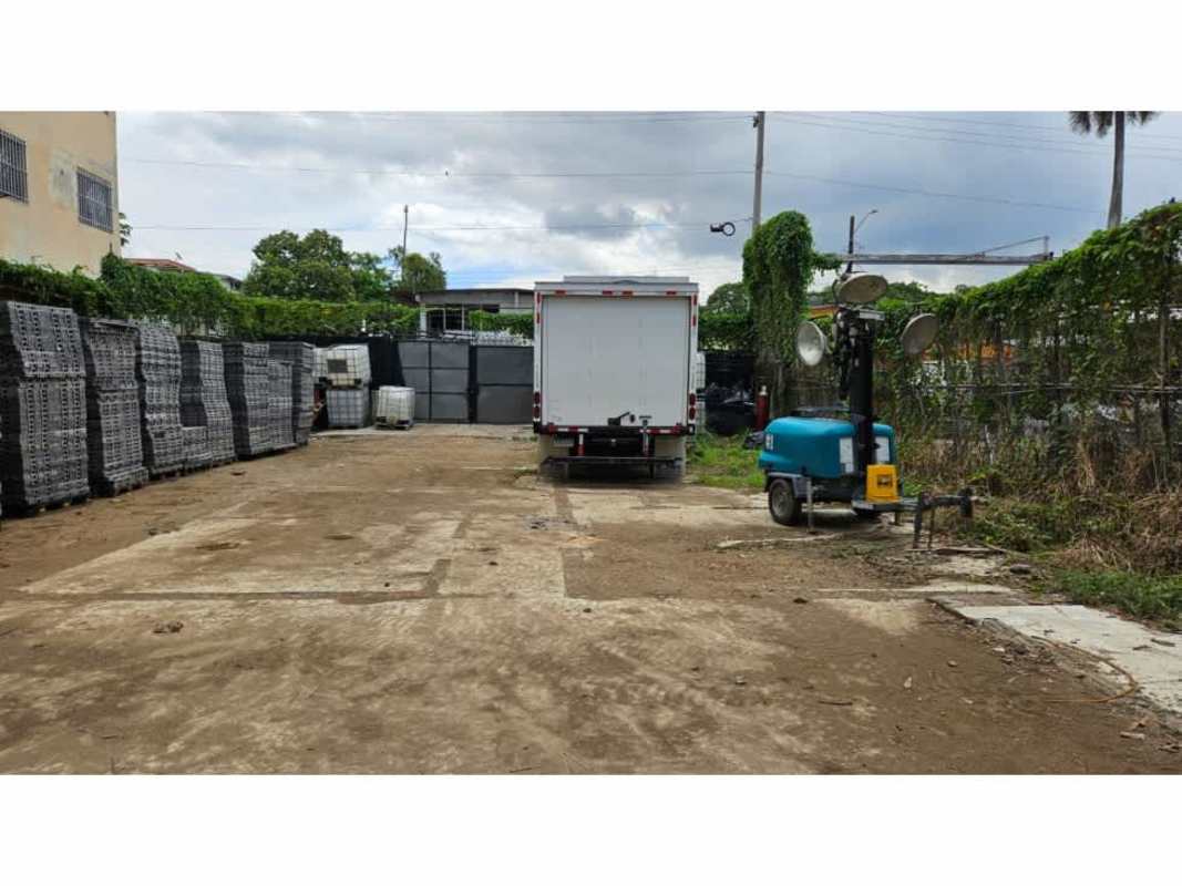 Flat commercial lot with warehouse trucks and fencing Parque Lefevre Panama