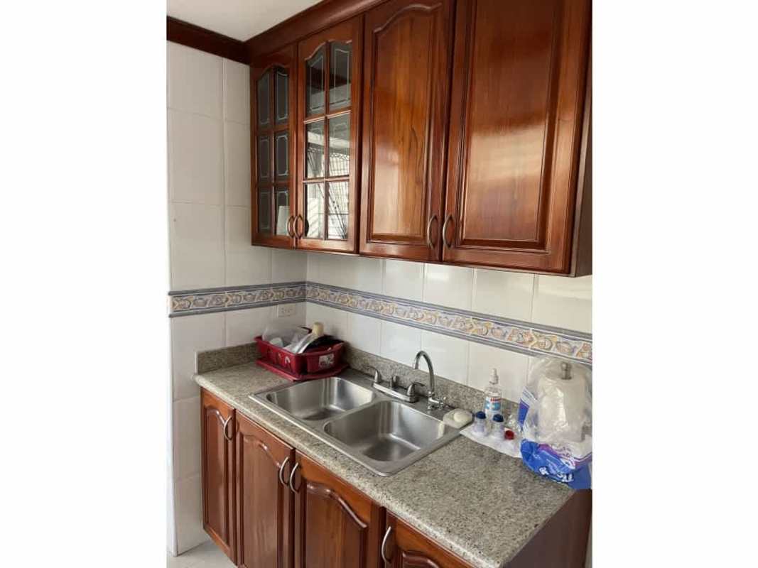 Kitchen with solid wood cabinets granite countertop double sink PH Torres del Sol