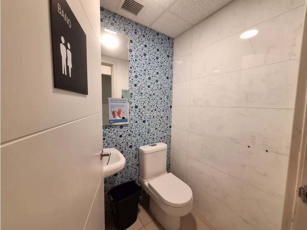 Spacious empty commercial unit with tile flooring and exposed ceiling at Habitats Plaza Panama