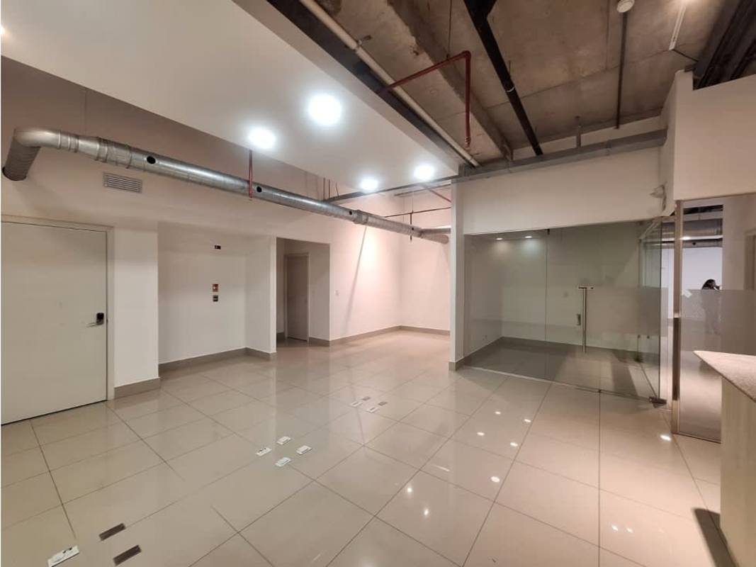 Glass office cubicles exposed ceilings tiled floors commercial rental Habitats Plaza Panama