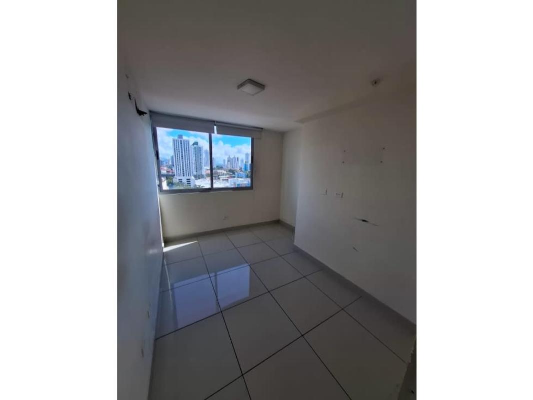 Bedroom with city skyline view, tile floor in PH Torres de Castilla Panama City