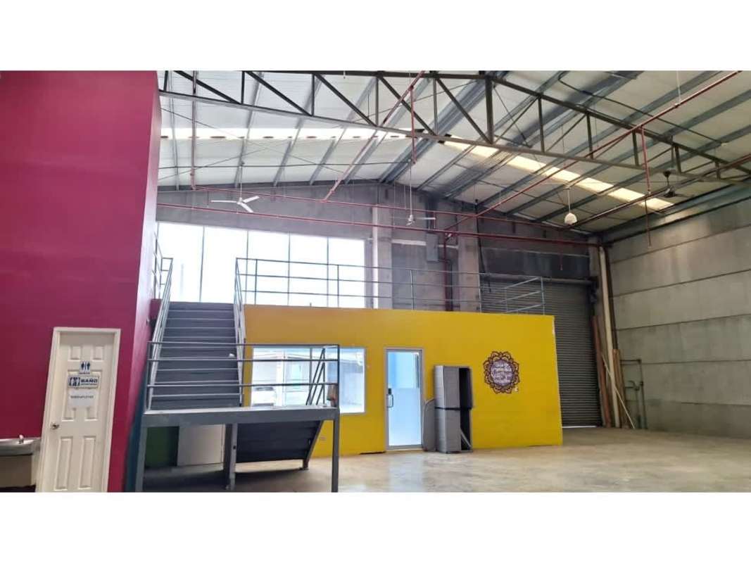 Modern industrial warehouse facade with parking in front Costa del Este Panama