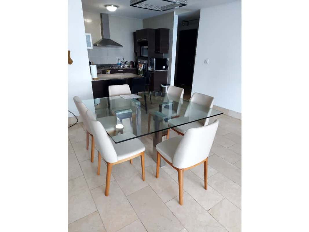 Modern furnished living room with access to oceanview terrace at Grand Tower Panama