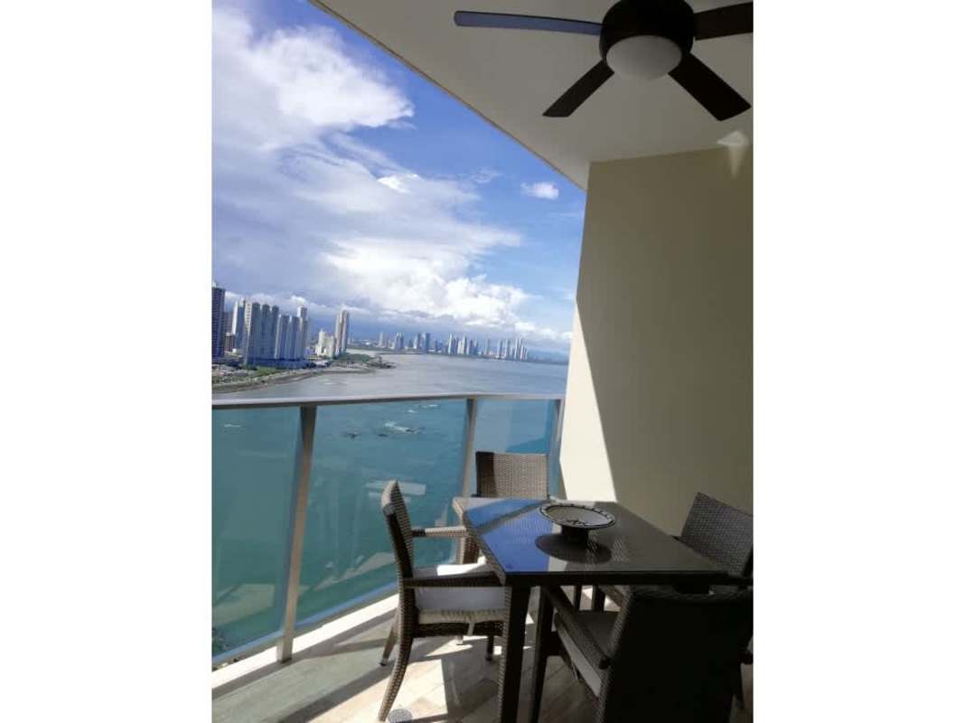 Open-plan kitchen and dining with granite and stainless steel PH Grand Tower Punta Pacífica Panama