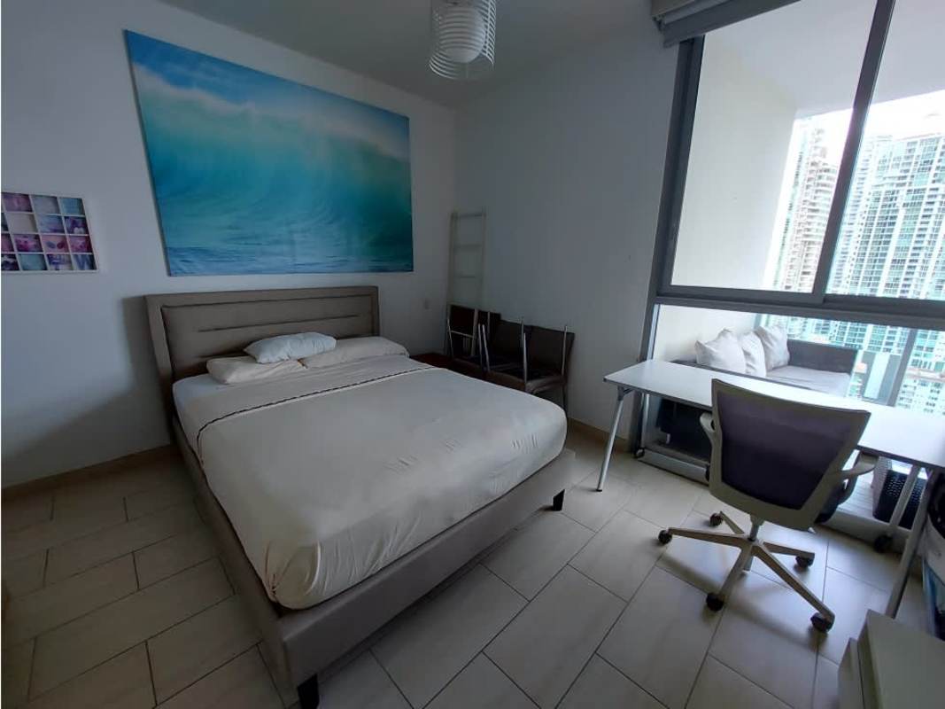 Bedroom with balcony access and skyline views PH Grand Tower Panama City