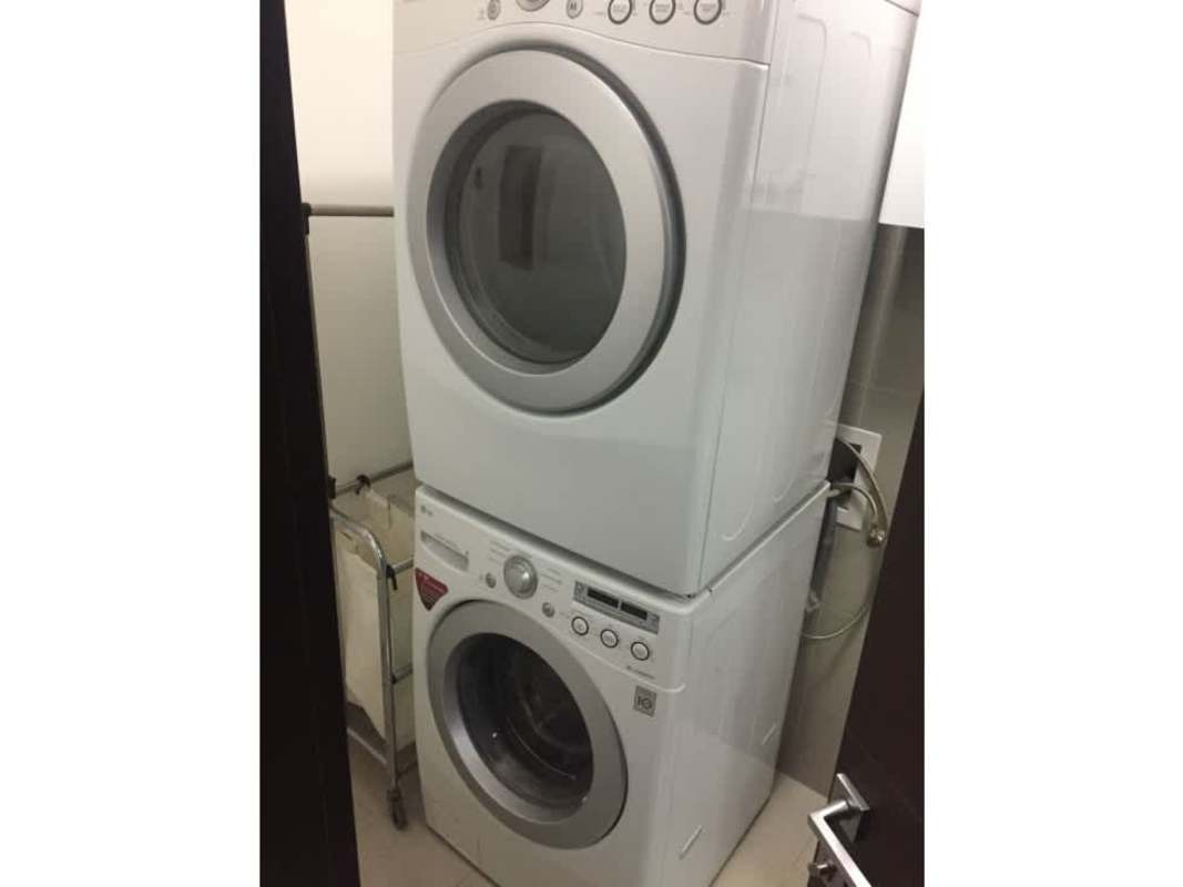 Laundry area with washer dryer utility sink in PH Grand Tower Punta Pacifica Panama