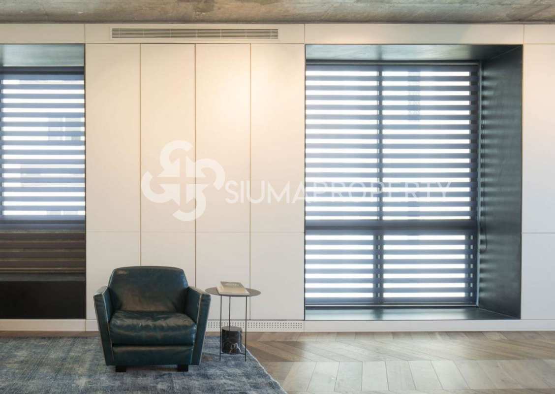 Minimalist living space with large windows leather chair PH Coco del Mar penthouse Panama