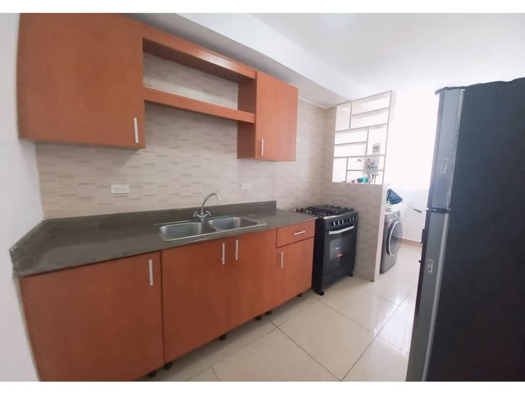 Modern kitchen with granite countertops, tile backsplash and integrated laundry in PH San Francisco Bay Tower 500 Panama